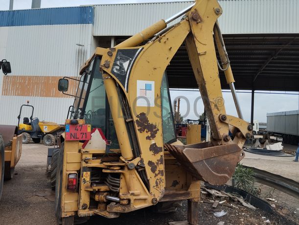 Conj. Ind. Pá e Retro de Pneus Caterpillar 428 DNF CM