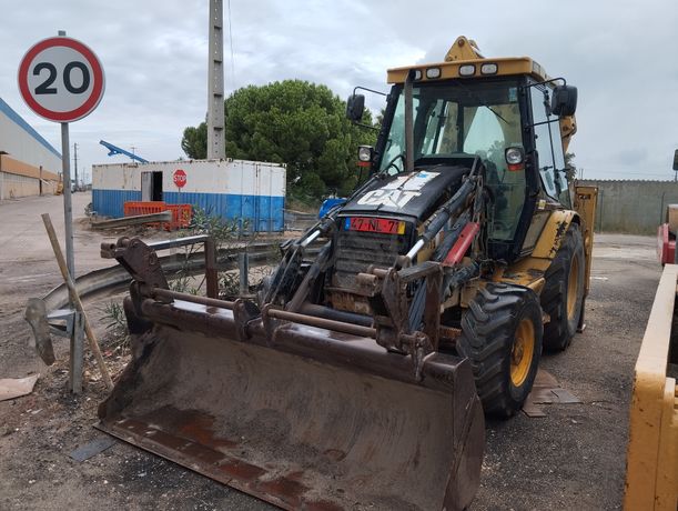 Conj. Ind. Pá e Retro de Pneus Caterpillar 428 DNF CM