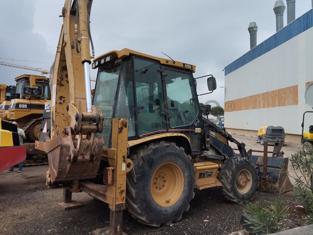 Conj. Ind. Pá e Retro de Pneus Caterpillar 428 DNF CM